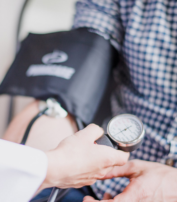 A Blood Pressure Cuff on a Patients Arm